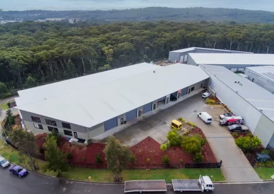 a large white-roofed warehouse building